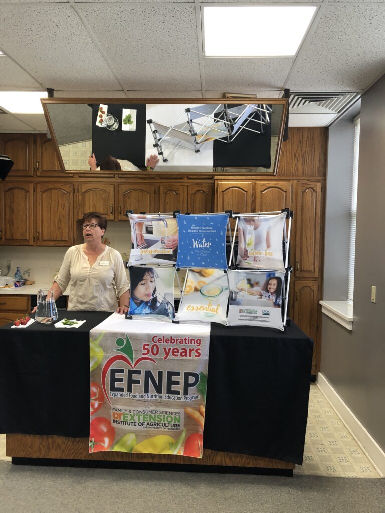 EFNEP agent presenting in a studio kitchen on healthy foods